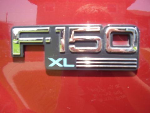 1996 Ford F-150 - F-150 XL badge on a red vehicle. Supermotors.net logo is also visible.