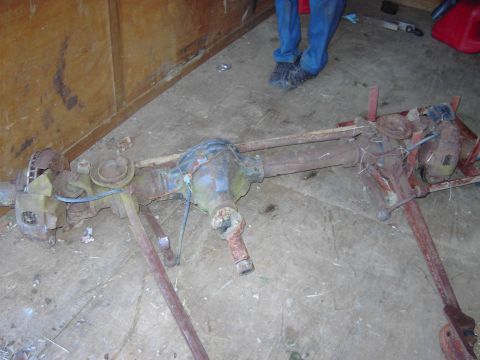 1991 Ford Bronco - This is a front axle assembly, likely for a Ford Bronco, showing signs of rust and wear.