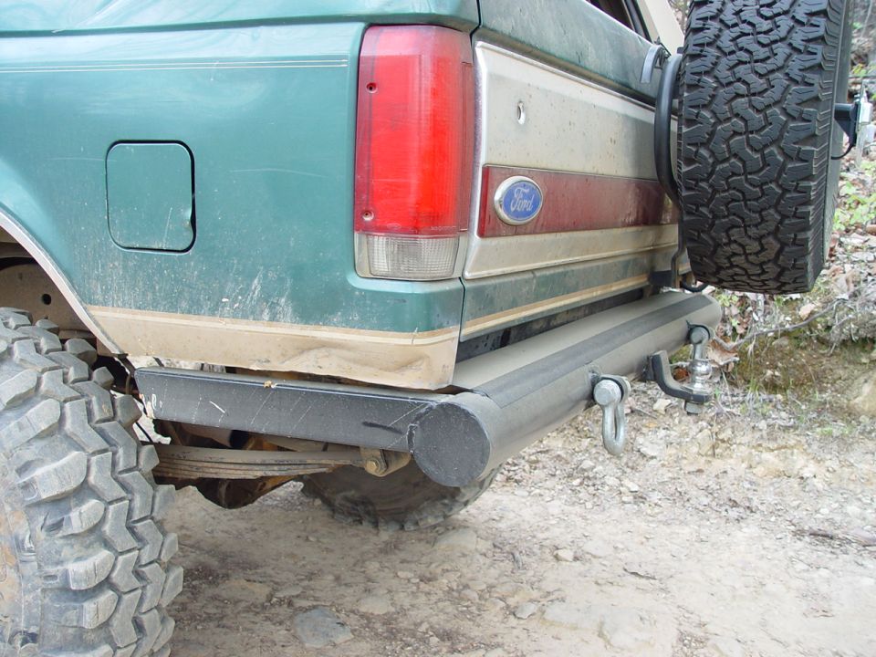 Green 1996 Ford Bronco rear with spare tire and tow hitch