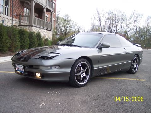 1995 Ford Probe - This 1995 Ford Probe GT coupe is shown in a three-quarter front view, highlighting its gray paint and tinted windows.