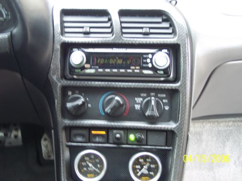 1995 Ford Probe - Close-up of a car's interior showing the center console with a Pioneer stereo and climate control knobs.