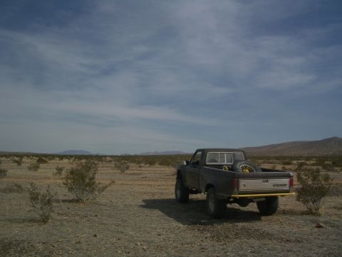 1985 Ford Ranger - A pickup truck sits in a desolate desert environment under a cloudy sky.