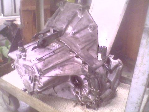 1993 Ford Taurus - A transmission assembly is shown mounted on a cart, likely for repair or storage.