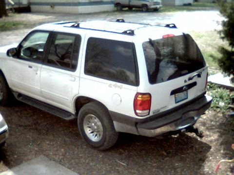 1999 Ford Explorer - This 1999 Ford Explorer is parked outdoors on a gravel surface.