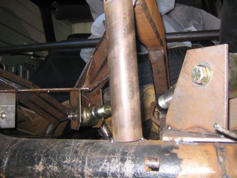 1969 Ford Mustang - Close-up view of custom fabricated rear suspension parts, showing metal fabrication and hardware.