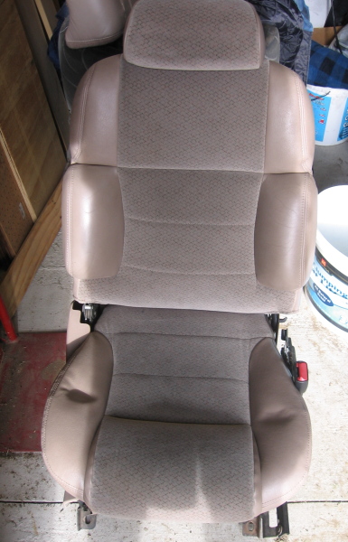 1993 Ford Thunderbird - A tan car seat with patterned fabric inserts and leather bolsters is shown, likely removed from a vehicle.