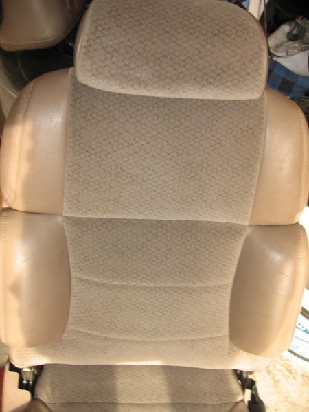 1993 Ford Thunderbird - Close-up view of a car's front seat, showing the upholstery and headrest.