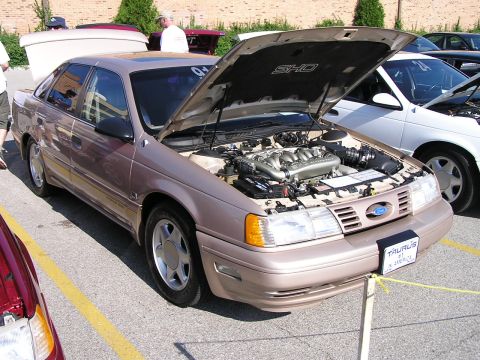 1993 Ford Taurus - Tan 1992 Ford Taurus SHO at a car show, hood open to display the V8 engine.