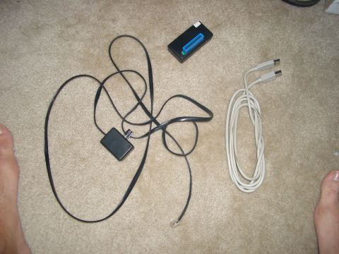 1990 Ford Bronco - Various electronic components and cables are laid out on a carpeted floor.