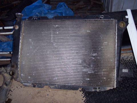 1974 Ford Bronco - A used radiator is shown, likely for a vehicle, with visible damage to its fins.