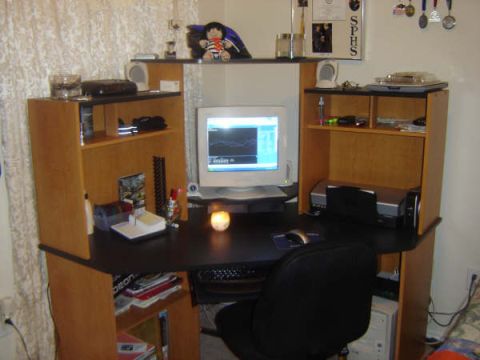1988 Ford LTD Crown Victoria - A home office desk setup a computer, printer, and organizational shelves.