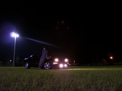 1994 Ford Probe - A man poses with his 1994 Ford Probe under a street light at night.