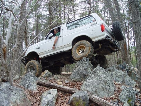 1996 Ford Bronco - This 1996 Ford Bronco is navigating a challenging rocky terrain off-road.