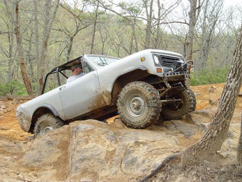 1996 Ford Bronco - This modified SUV navigates a rocky trail, its off-road capabilities.