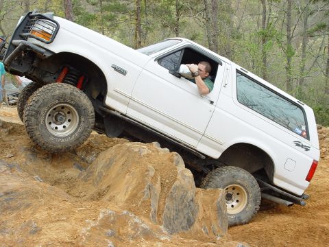 1996 Ford Bronco - This 1996 Ford Bronco navigates a challenging rocky terrain during an off-road excursion.