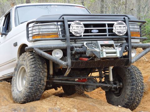 1996 Ford Bronco - This modified Ford Bronco is equipped for off-road use with large tires and a winch mounted on the front bumper.