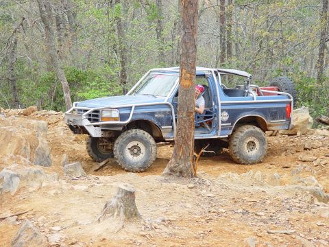 1996 Ford Bronco - This modified 1996 Ford Bronco navigates a challenging rocky terrain.