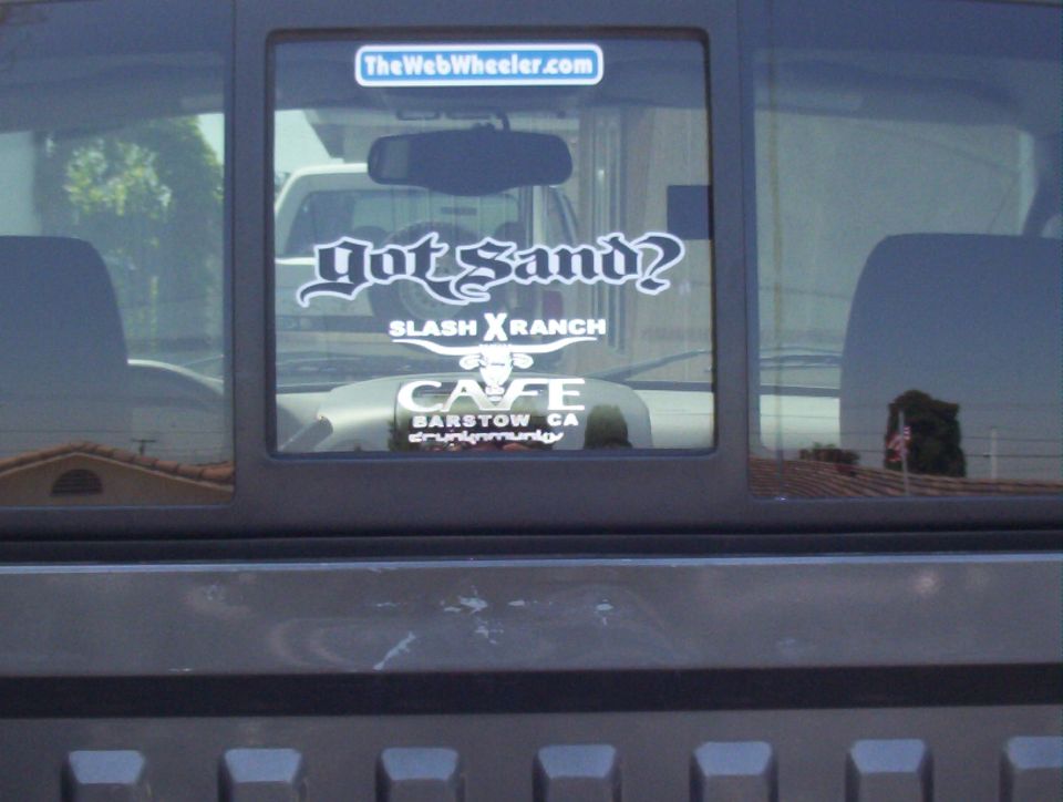 Pickup rear window with Got Sand and Slash X Ranch Cafe Barstow decals