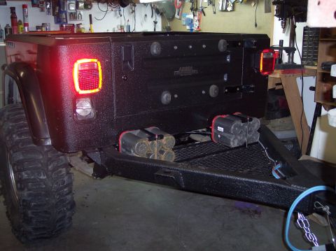 2003 Jeep TJ - Rear view of a 2003 Jeep TJ showing custom bumper and added fuel storage.