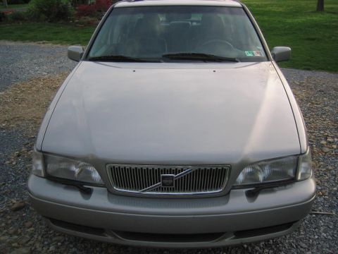 1993 Ford Probe - Front view of a silver Volvo sedan, showing the grille and headlights. A license plate is visible on the dashboard.