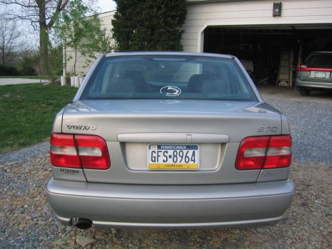 1993 Ford Probe - Rear view of a silver Volvo S70, showing the license plate and a sticker on the rear window.