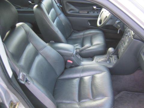 1993 Ford Probe - Interior view of a car with black leather seats and automatic transmission.