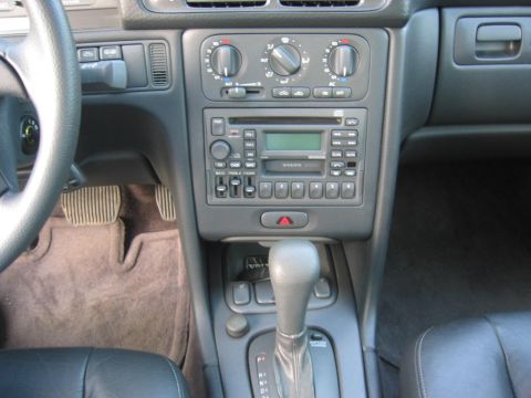 1993 Ford Probe - The center console of a Volvo features its radio, climate controls, and automatic gear shifter.
