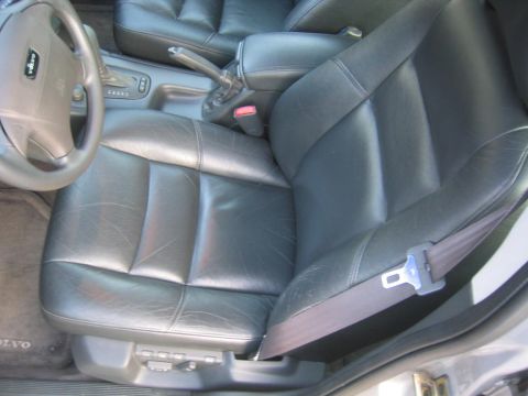 1993 Ford Probe - The interior of a Volvo is shown, black leather seats and the dashboard area.