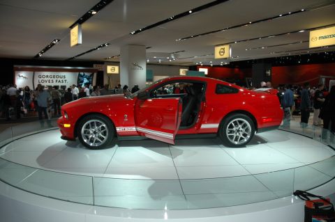 2005 Ford Mustang - Red 2007 Ford Mustang GT500 displayed with its driver door open.