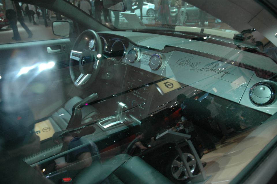 Interior of a car with Carroll Shelby's signature on the dashboard