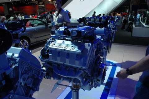 2005 Ford Mustang - Close-up of a Ford SVT V8 engine on display, likely at an auto show.