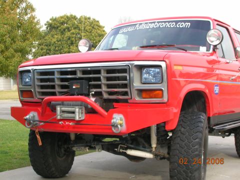 1985 Ford Bronco - Front view of a red Ford Bronco, modified with a custom bumper and winch. Date stamp reads 02 24 2006.