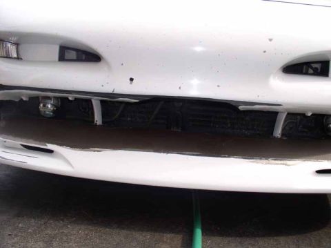 1996 Ford Probe - Front view of a white 1996 Ford Probe, showing the bumper, grille, and fog lights.