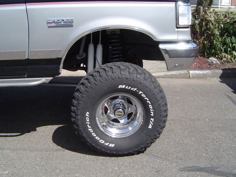 1989 Ford Bronco - This 1989 Ford Bronco features a lifted suspension and BFGoodrich Mud-Terrain T/A tires, visible from the side.