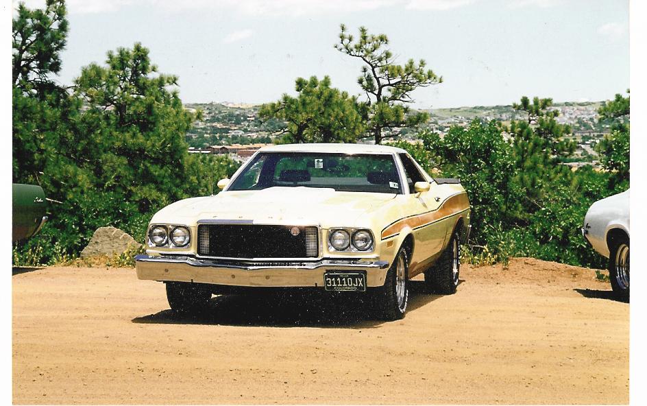 Yellow and tan 1972 Ford Ranchero front view with a black grille and stripe detail