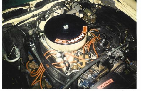 1972 Ford Ranchero - Close-up view of a V8 engine, a prominent air filter assembly and numerous spark plug wires.