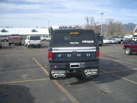 1992 Ford Ranger - This 1992 Ford Ranger is seen from the rear, "Big Sky Country Montana" mud flaps and a camper shell.