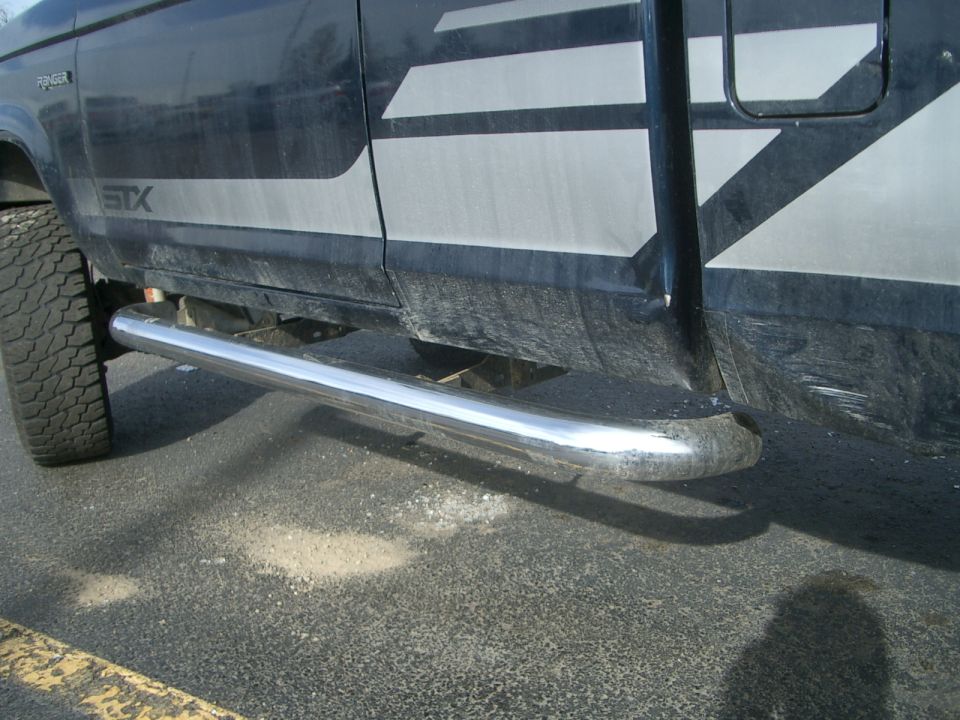 Side view of a 1992 Ford Ranger STX truck with chrome side steps