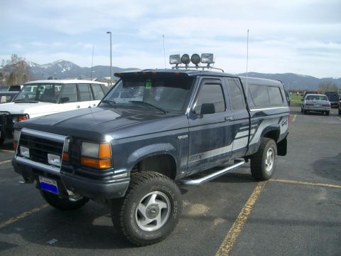 1992 Ford Ranger - This 1992 Ford Ranger STX pickup truck features a camper shell and auxiliary lighting.