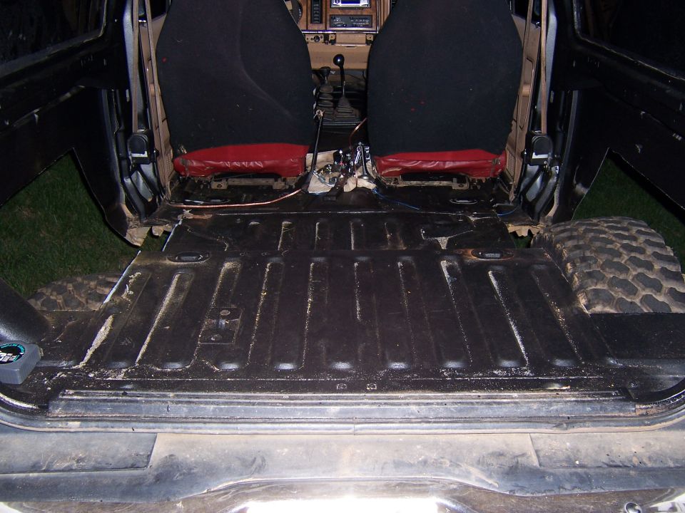 1984 Ford Bronco II interior with rear seats removed, showing the floor pan