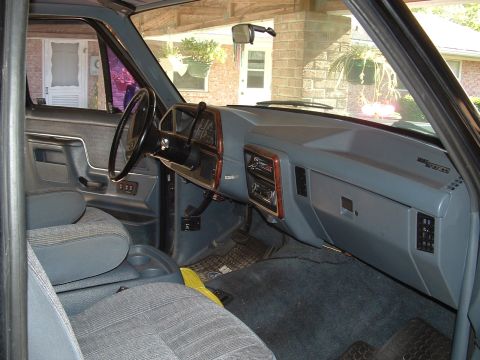 1989 Ford Bronco - Interior view of a 1989 Ford Bronco, highlighting the dashboard and seating area.