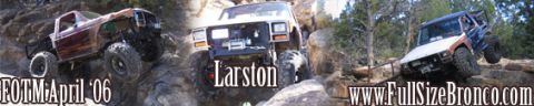 1996 Ford Bronco - Multiple off-road vehicles navigate a challenging rocky trail.