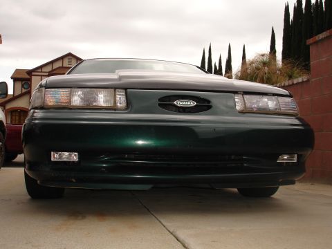 1993 Ford Taurus - Front view of a green car with a Yamaha badge on the grille.