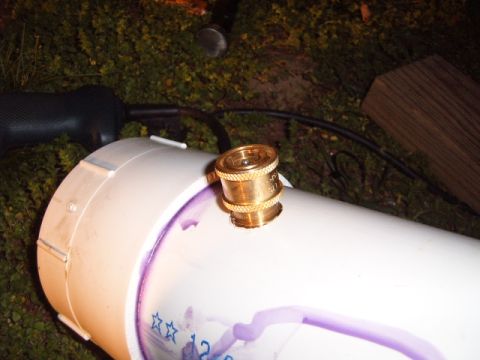 1988 Ford Bronco - A close-up view of a PVC pipe with a brass fitting and purple markings, with a Supermotors.net logo in the corner.