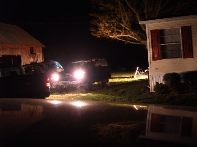 1988 Ford Bronco front view at night with headlights on