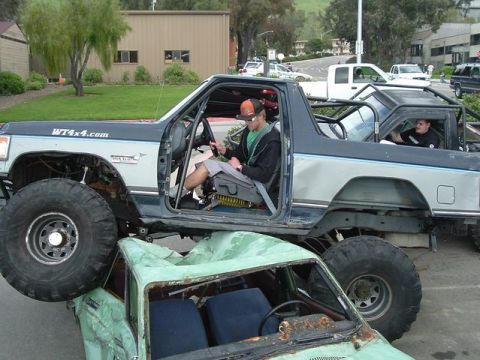 1989 Ford Bronco - Modified 1989 Ford Bronco is shown on top of another vehicle, with WT4x4.com text on the door.
