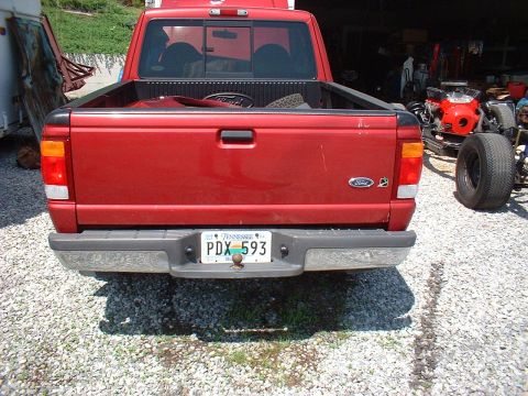 1999 Ford Ranger - Rear view of a red Ford Ranger pickup truck with a Tennessee license plate.