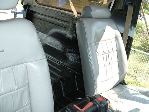 1978 Ford Bronco - Interior view of a vehicle's front seats and cargo area.