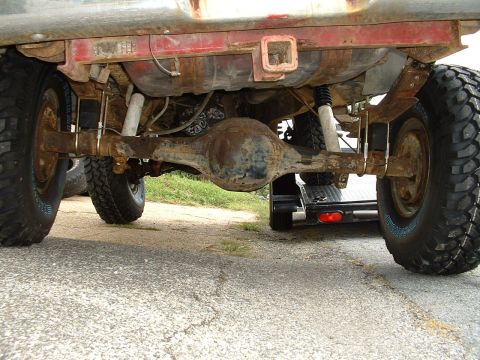 1978 Ford Bronco - Undercarriage view of a truck's rear axle and suspension components.
