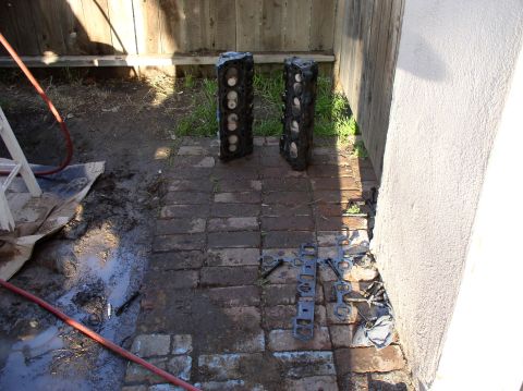 1988 Ford Bronco - Engine block halves and gaskets are laid out on a brick patio, suggesting a repair or disassembly process.